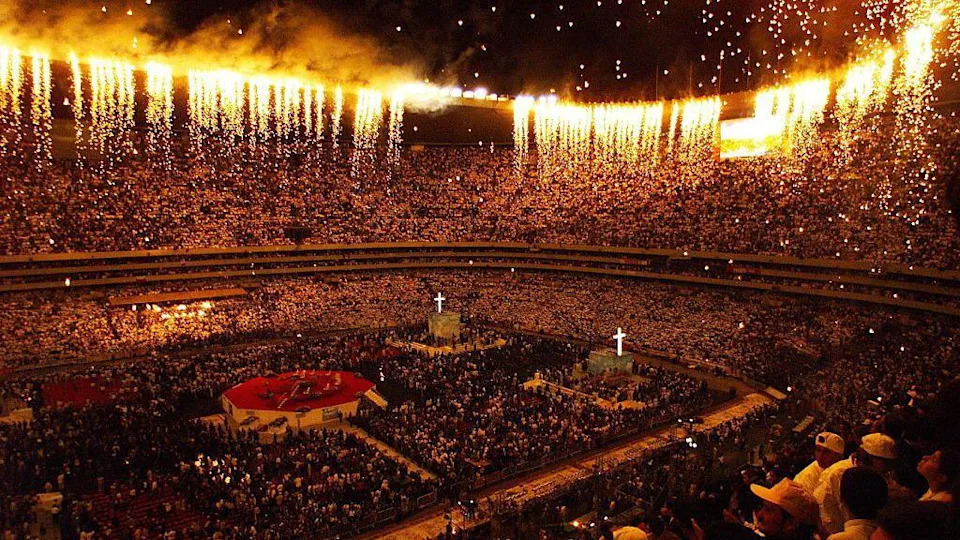 Fireworks shoot from the roof of Azteca Stadium in Mexico City at the end of a Catholic mass delivered by Pope John Paul II in 1999