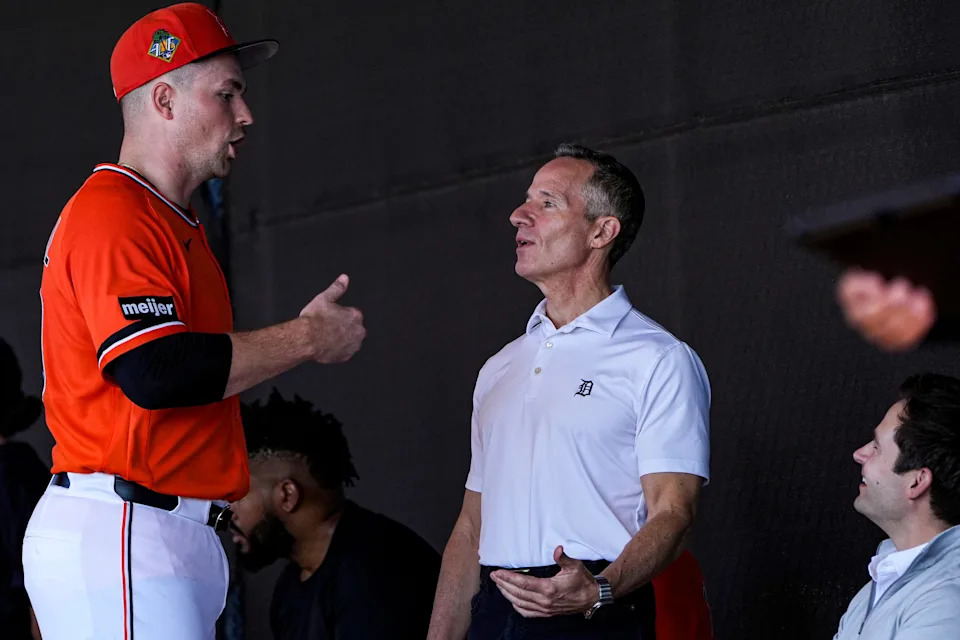 Detroit Tigers pitcher Tarik Skubal, left, talks to team owner Chris Ilitch, center, and president of baseball operations Scott Harris at practice during spring training at TigerTown in Lakeland, Fla. on Friday, Feb. 20, 2026.