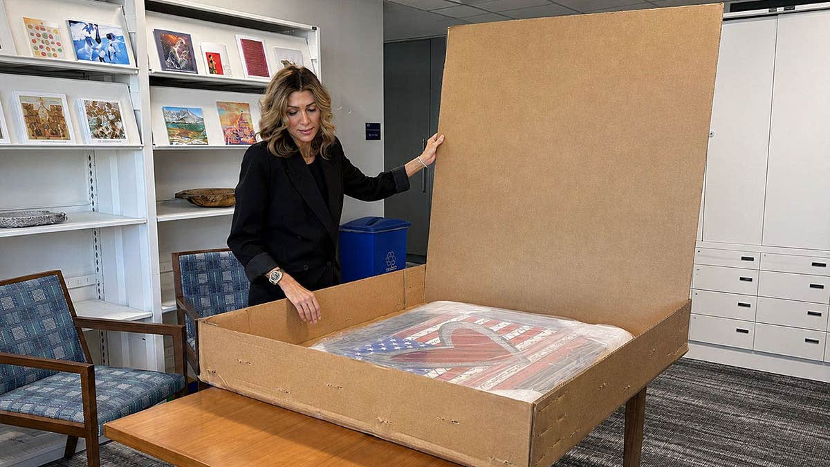 State Department Art in Embassies Director Erin Scavino unboxes Romero Britto artwork
