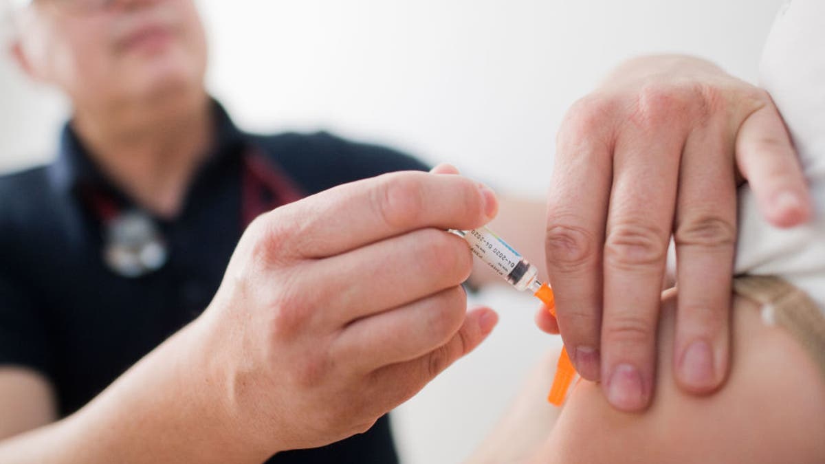 Child receives vaccines