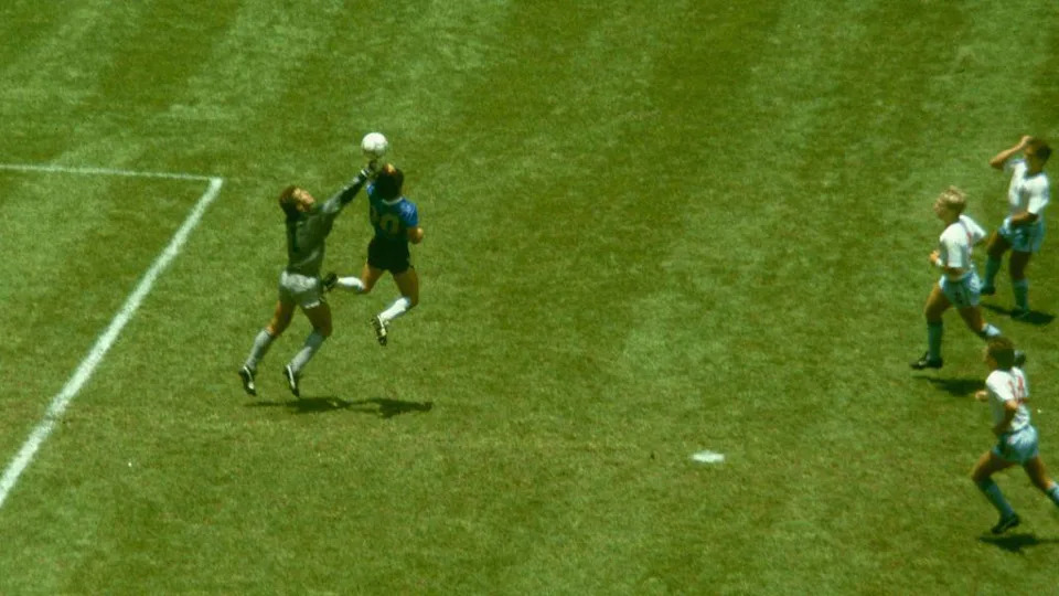 Maradona rises in front of Peter Shilton and meets the ball with his hand as he scores the notorious Hhand of God goal which opened the scoring in Argentina's 2-1 victory over England in the 1986 World Cup at Estadio Azteca in Mexico City