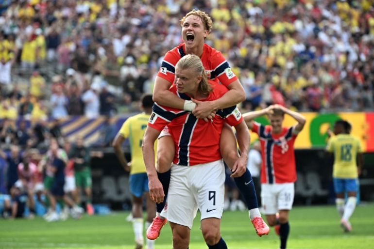 Norway's forward #09 Erling Braut Haaland celebrates scoring his team's second goal with teammate midfielder #21 Andreas Schjelderup during the 2026 World Cup round of 16 football match between Brazil and Norway at the New York/New Jersey Stadium in East Rutherford on July 5, 2026.