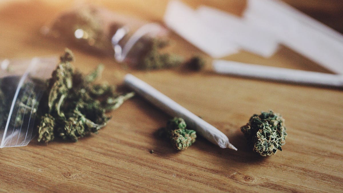 Cannabis products are arranged on a surface.