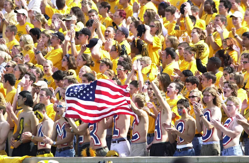 Sept. 29, 2001: Fans wave an American flag before the Missouri-Nebraska game at Faurot Field in Columbia, Missouri. The Cornhuskers beat the Tigers, 36-3.