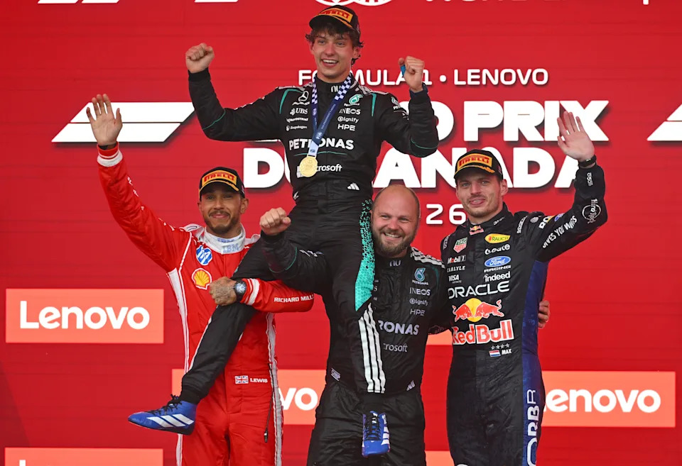 MONTREAL, QUEBEC - MAY 24: Race winner Andrea Kimi Antonelli of Italy and Mercedes AMG Petronas F1 Team Second placed Lewis Hamilton of Great Britain and Scuderia Ferrari Third placed Max Verstappen of the Netherlands and Oracle Red Bull Racing and Dean Hale, Senior Race Team Composite Technician at Mercedes AMG Petronas F1 Team on the podium during the F1 Grand Prix of Canada at Circuit Gilles-Villeneuve on May 24, 2026 in Montreal, Quebec.