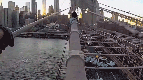 Dramatic bodycam video captures NYPD officer rescuing woman from top of Brooklyn Bridge after emotional plea