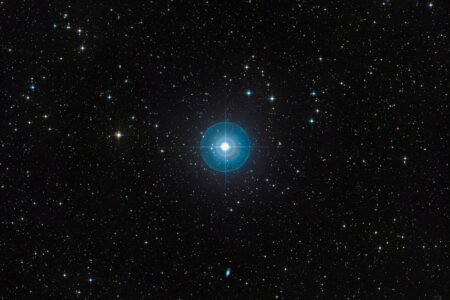 Faint new planet is found after cosmic hide-and-seek