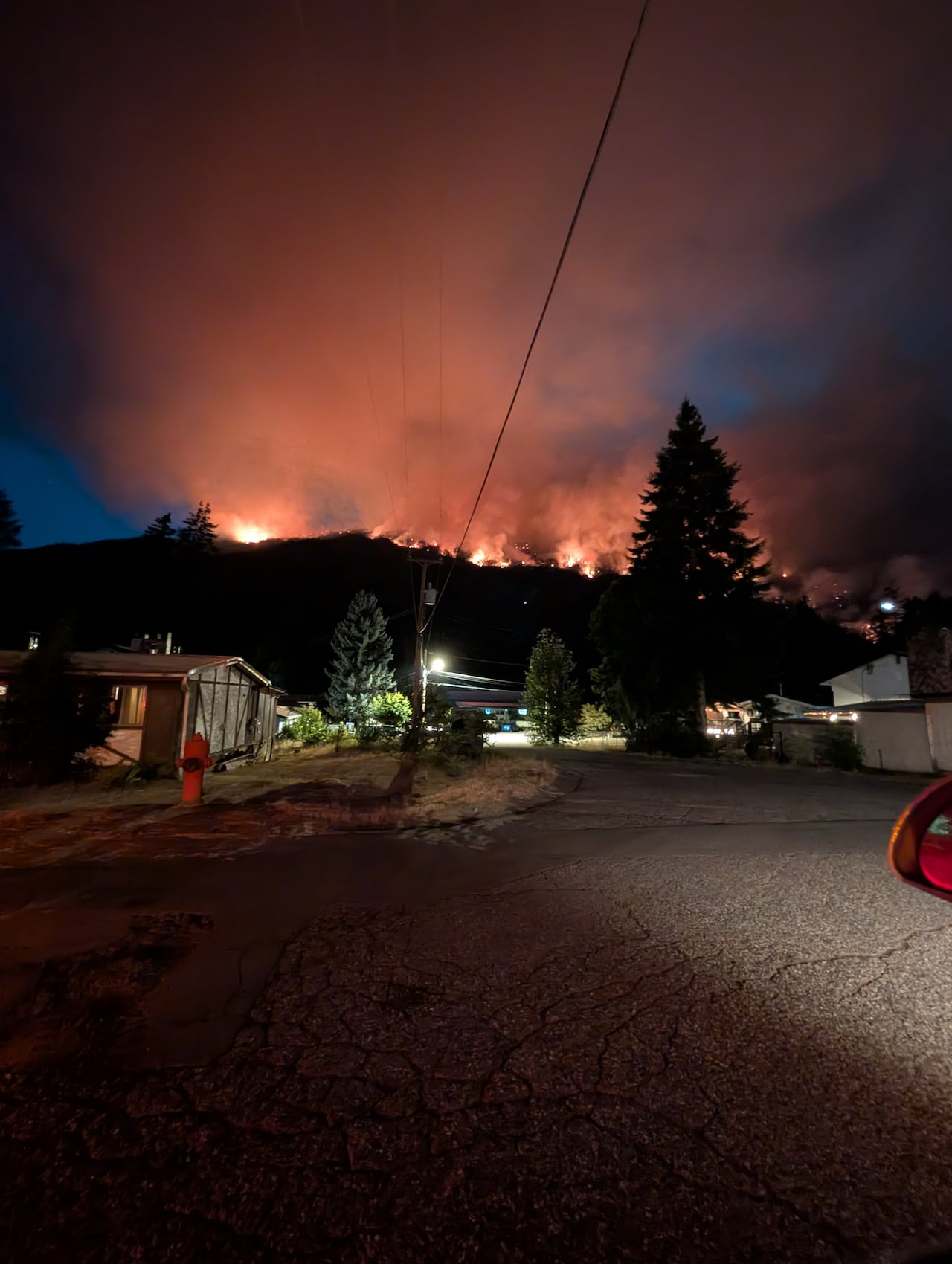 Fire behind houses.