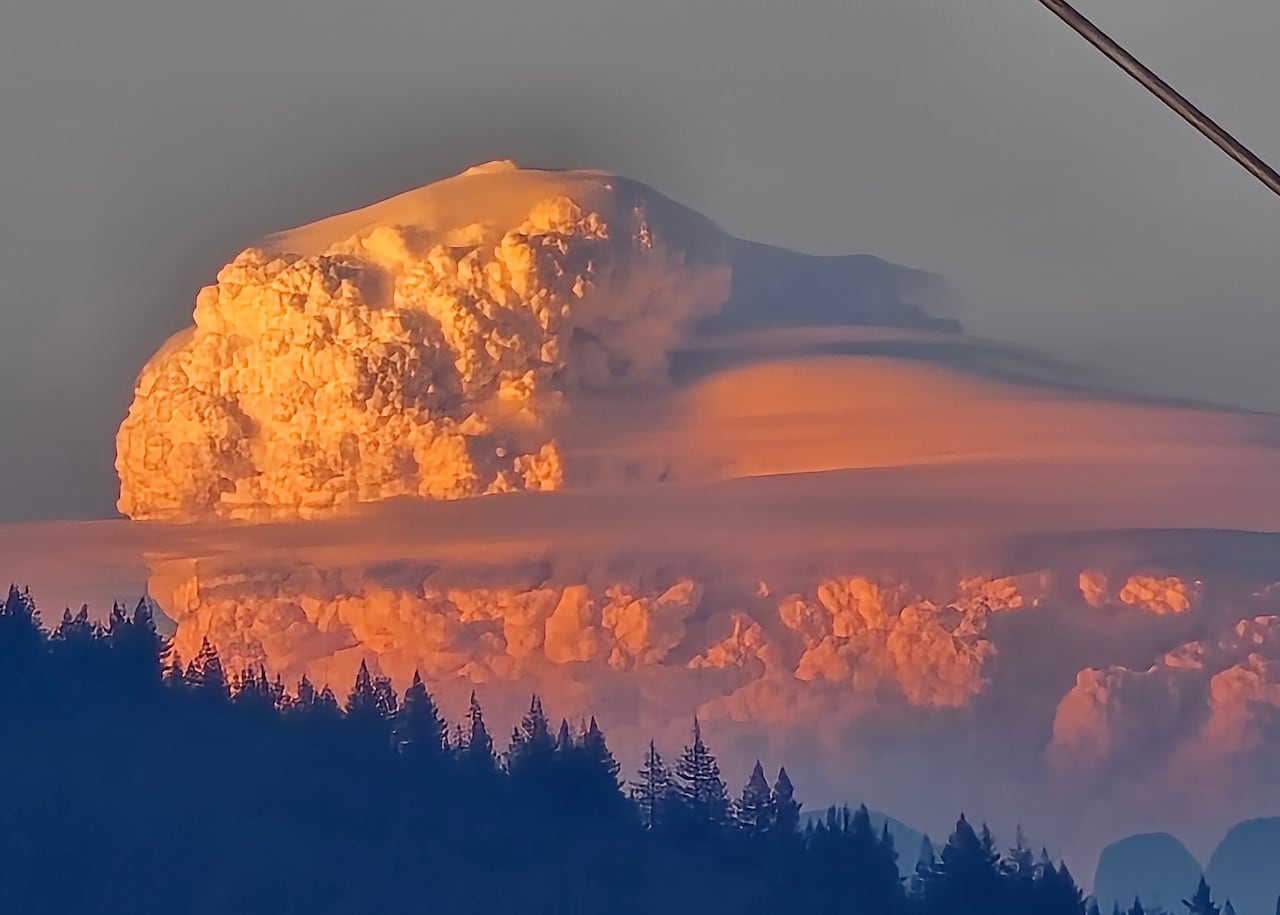 Big fluffy clouds reflecting orange light.
