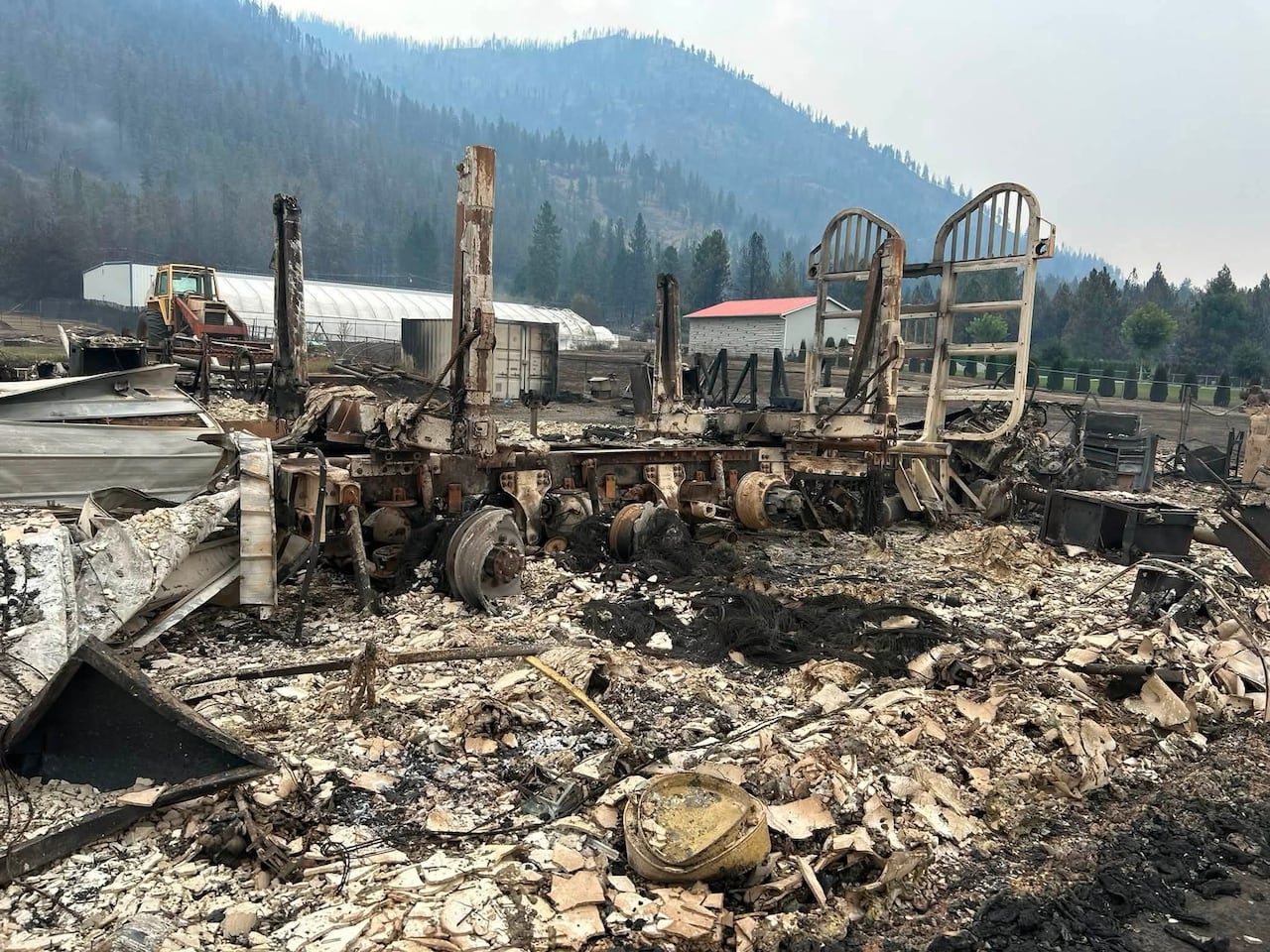 A photo of a burned out logging truck.