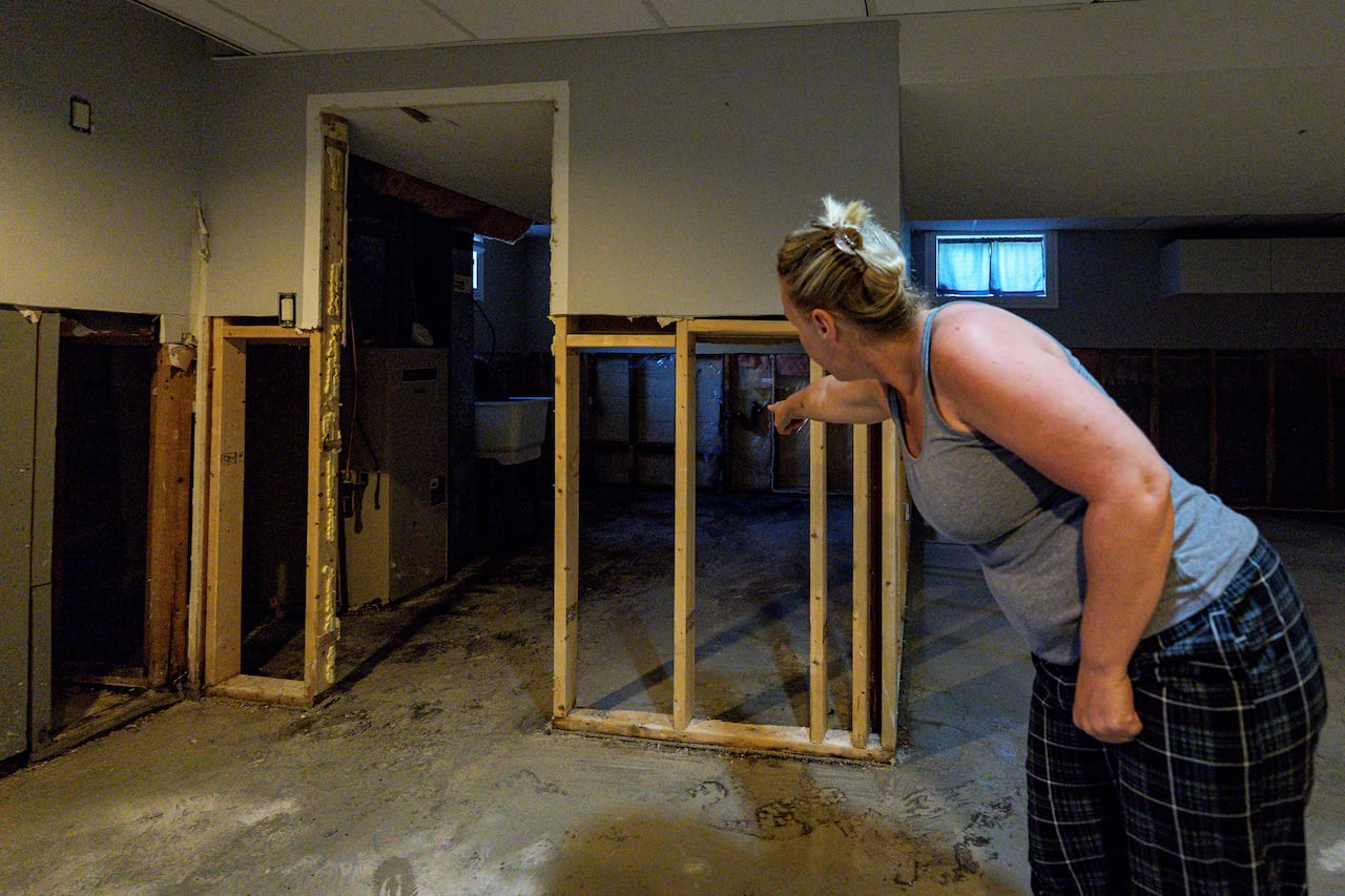A homeowner is pictured in her St. Catharine’s, Ont., basement on Aug. 4, 2026.