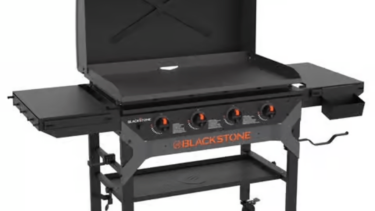 A flat-top grill ready to use with it's lid open.