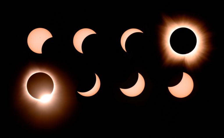 In this composite of eight photographs, the moon passes by the sun into totality and away again during a total solar eclipse in Bloomington, Indiana, US, on April 8, 2024