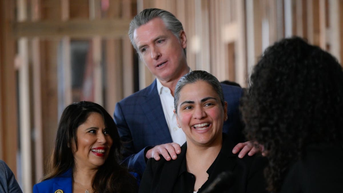 HAYWARD, CA - MARCH 2: Senator Aisha Wahab (C) attends a press conference as Governor Gavin Newsom criticizes U.S. President Donald Trump’s decision to strike Iran during a press conference about new statewide accountability and funding for homelessness and mental health in Hayward, California, United States, on March 2, 2026. (Photo by Tayfun Coskun/Anadolu via Getty Images)