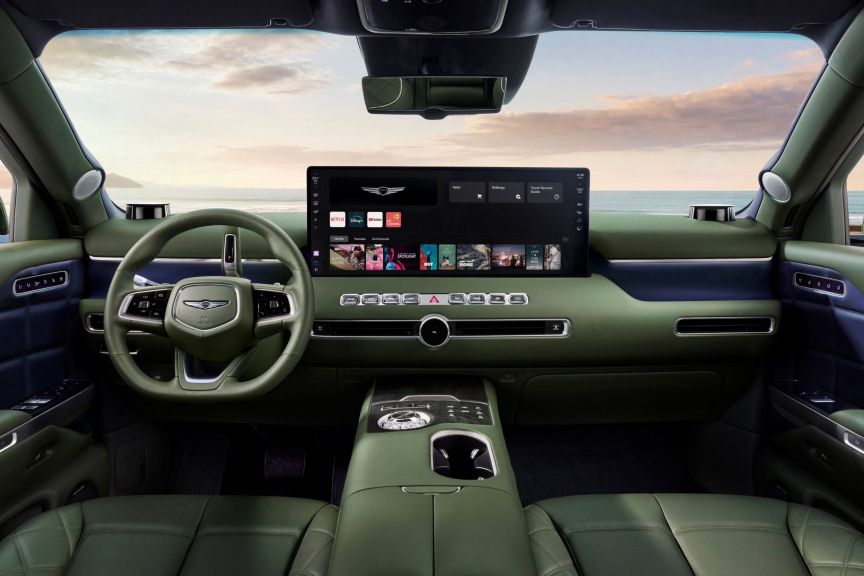 Genesis GV90's dashboard with large center screen and green upholstery