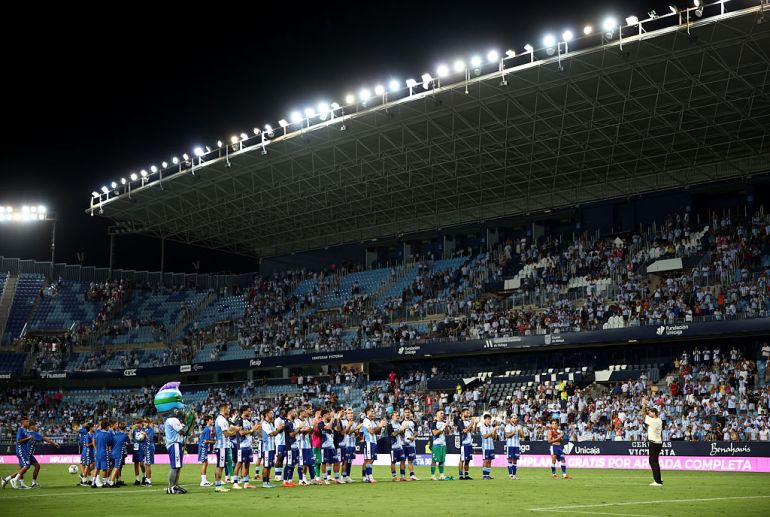 Malaga players stay to celebrate with their fans after Fulham’s walk-off in the Trofeo Costa del Sol preseason friendly