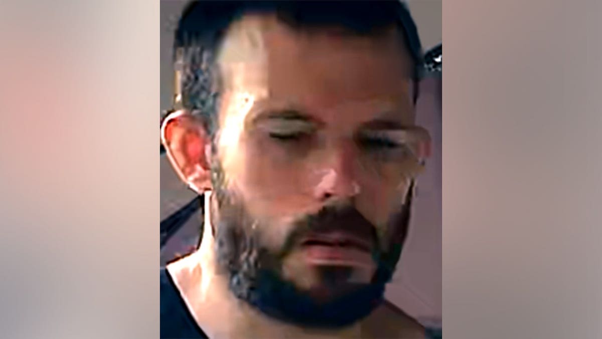 Thomas David Ryan walking in an surveillance image