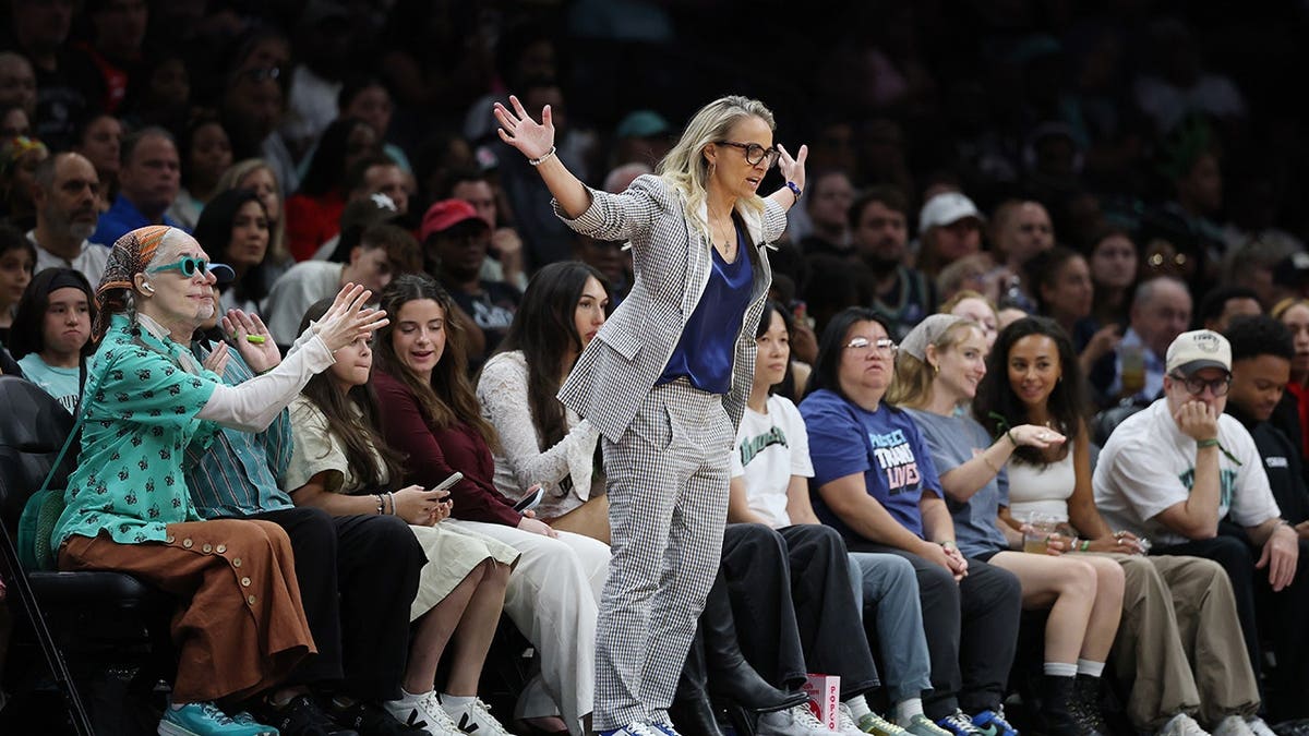 Becky Hammon, head coach of the Las Vegas Aces, looks on during a game.