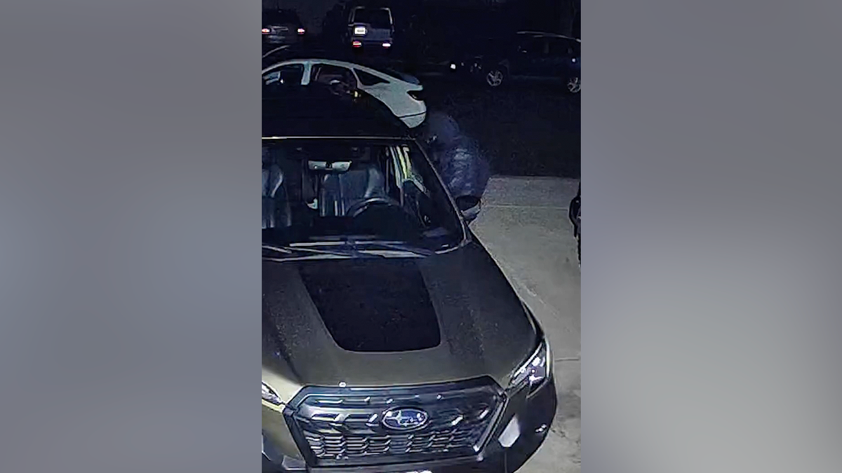 Burglary suspect caught entering parked vehicle