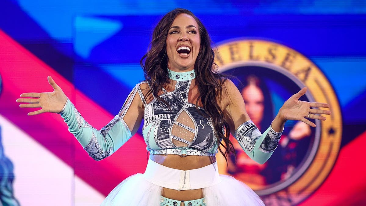 Chelsea Green walks toward the ring at Oakland Arena.