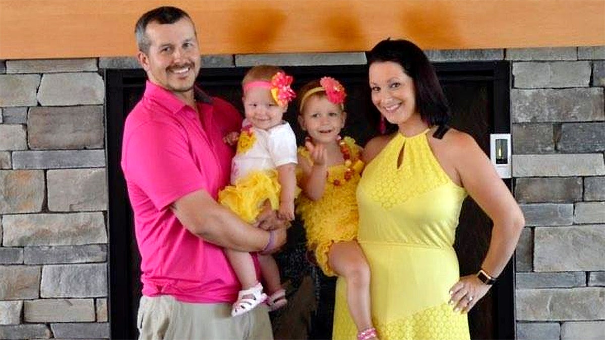 Chris and Shanann Watts with their two daughters posing in an undated photo.