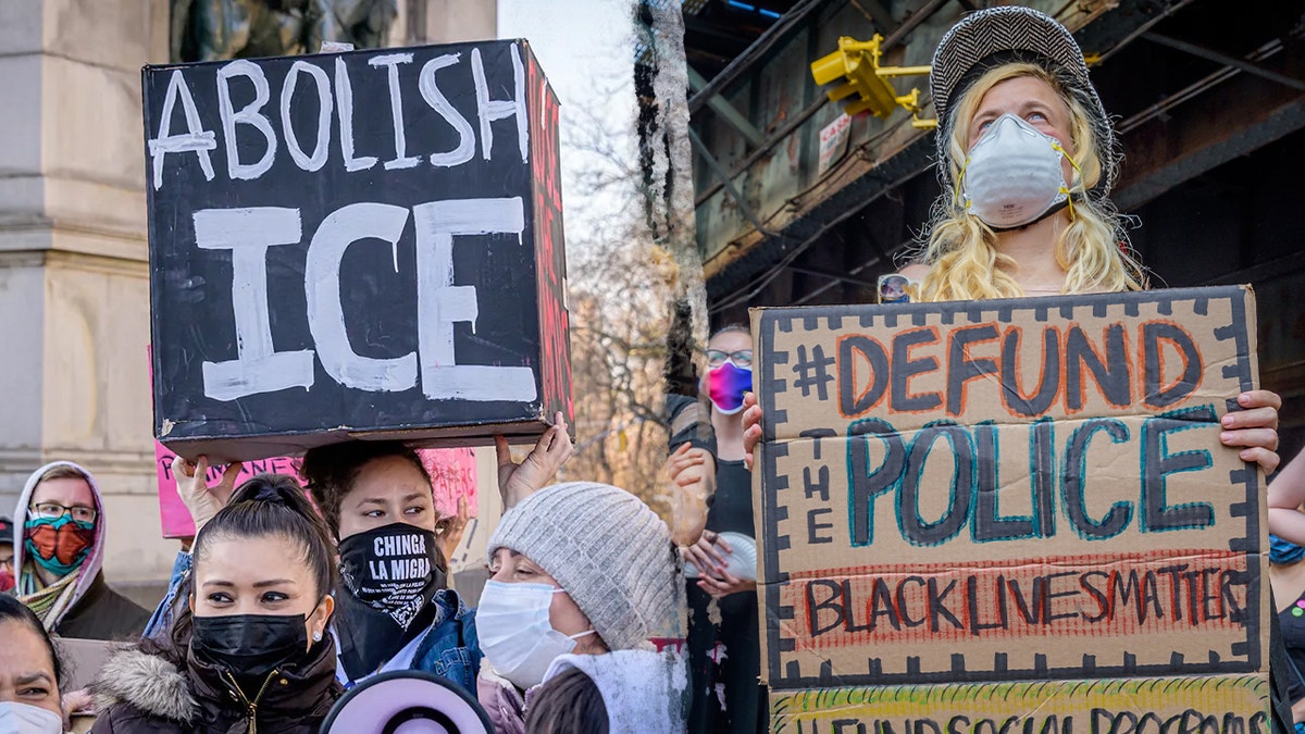 Protestors carrying signs