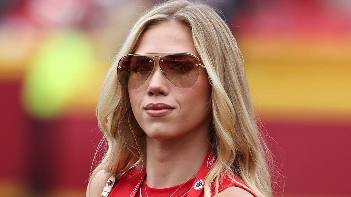 Gracie Hunt stands on the sidelines before an NFL game between the Philadelphia Eagles and Kansas City Chiefs.