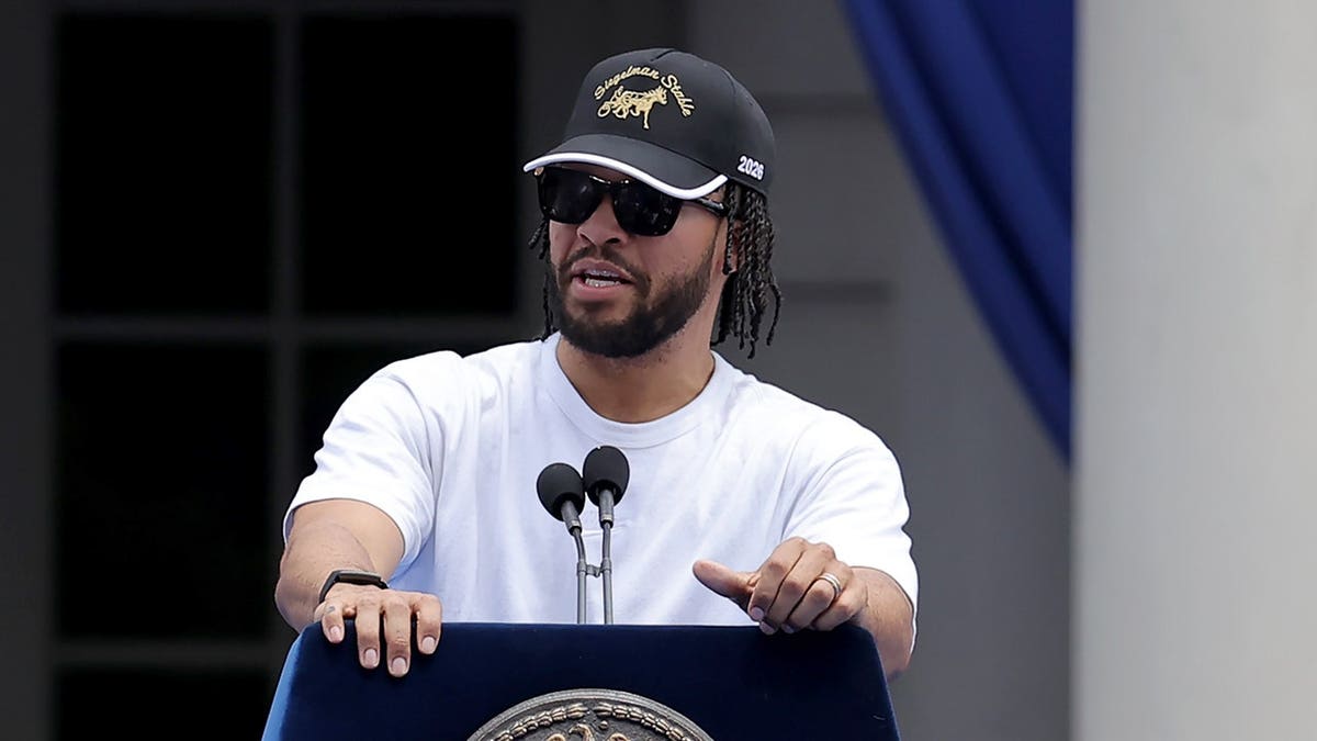 Jalen Brunson speaks at a ceremony at New York City Hall after the Knicks championship parade.