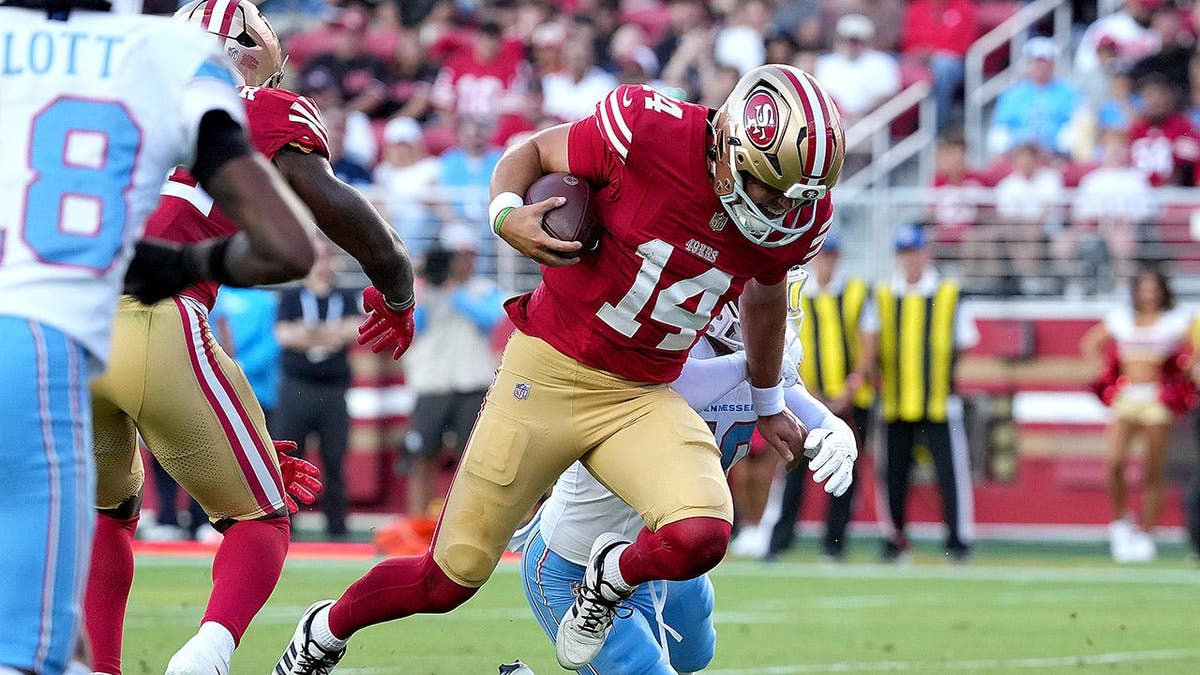 Kurtis Rourke scrambles with the ball near the one-yard line against the Tennessee Titans.