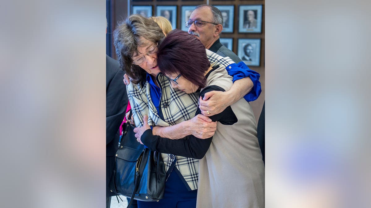 Raquel Herr embraces Junko Kibuishi outside the courtroom in Santa Ana, Calif.