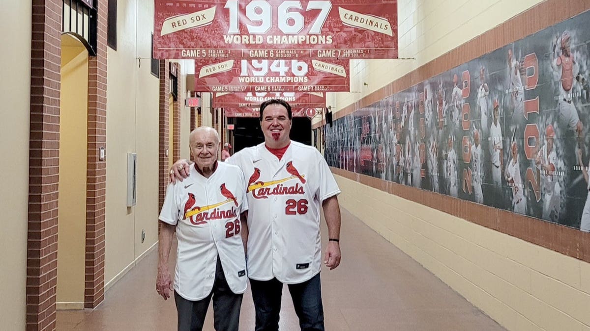 Scott and Ed Spiezio stand together.