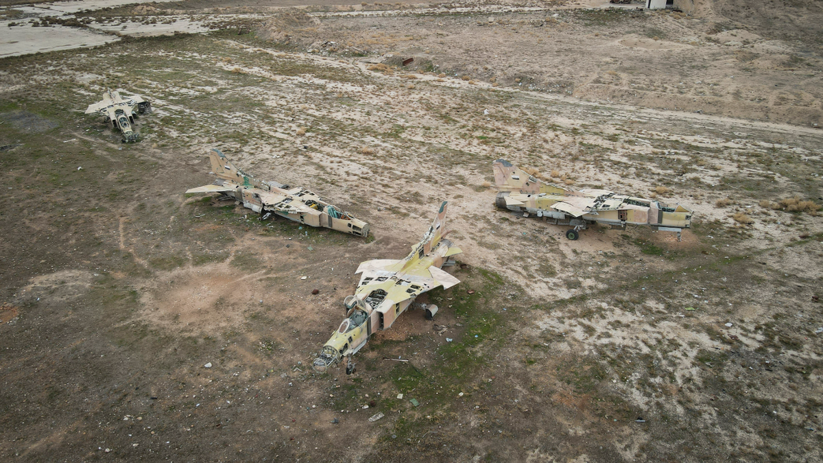 Decommissioned Syrian air force planes are seen at the Abu Duhur military airbase
