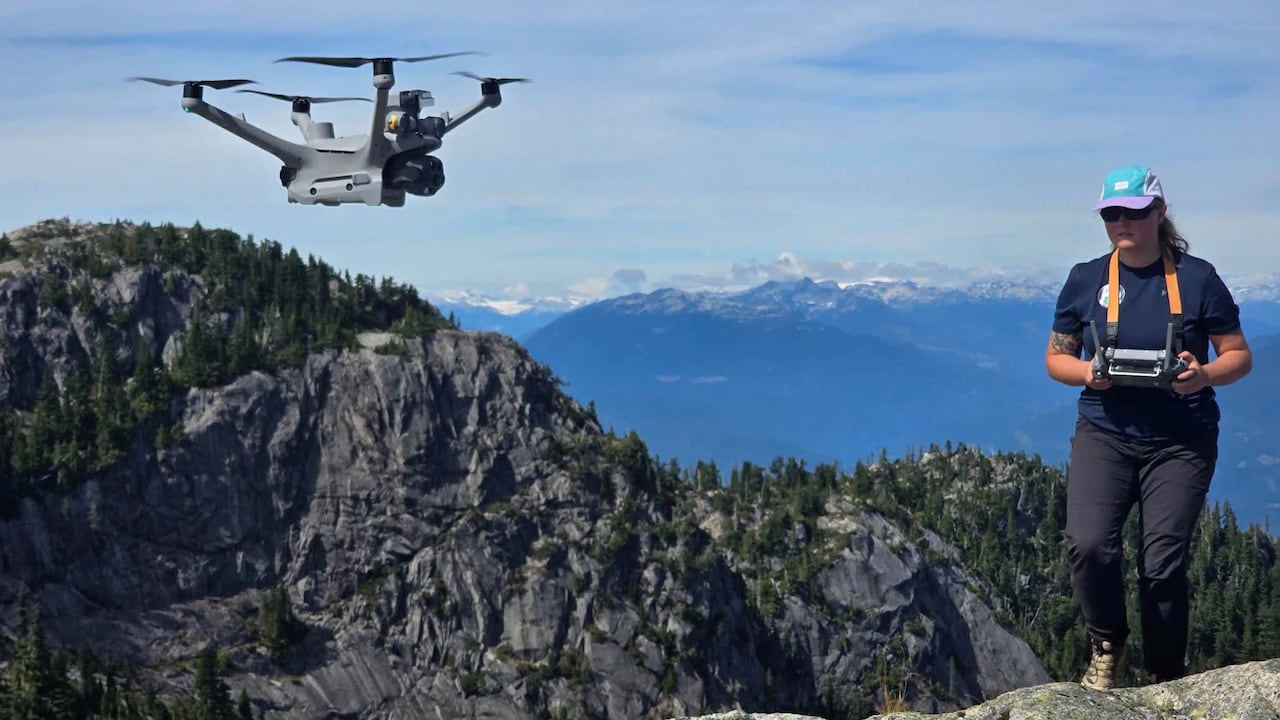 A person flying a drone.