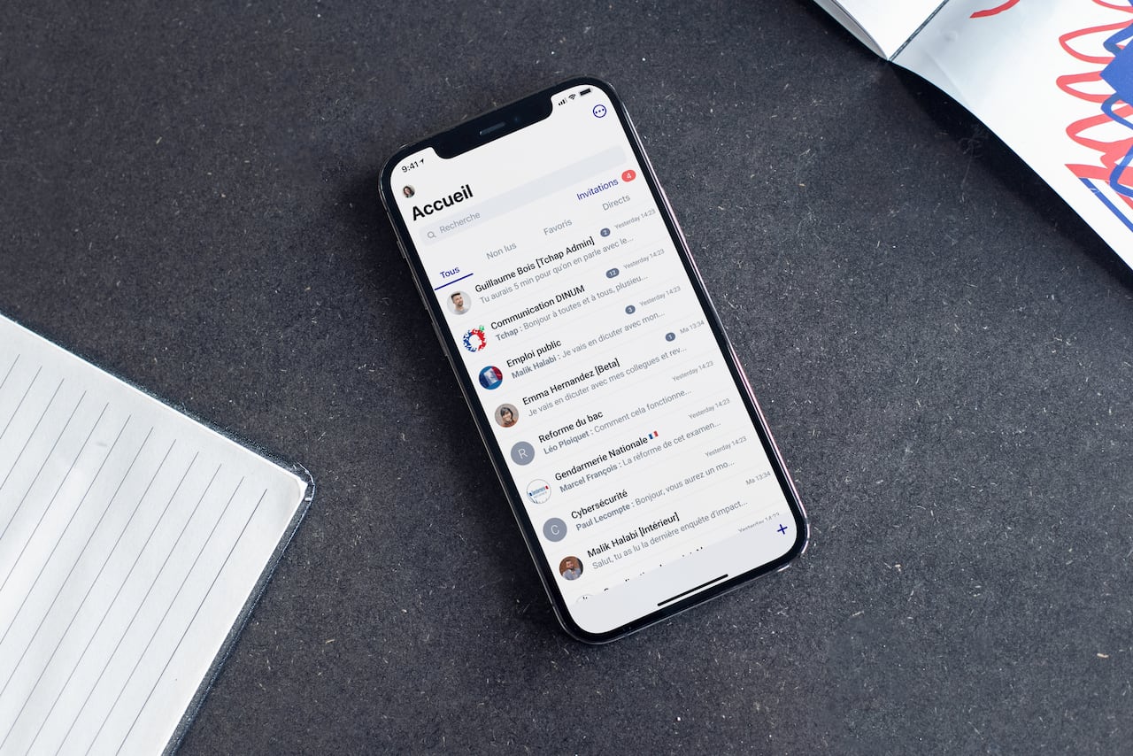 A phone on a table with a messaging app open.
