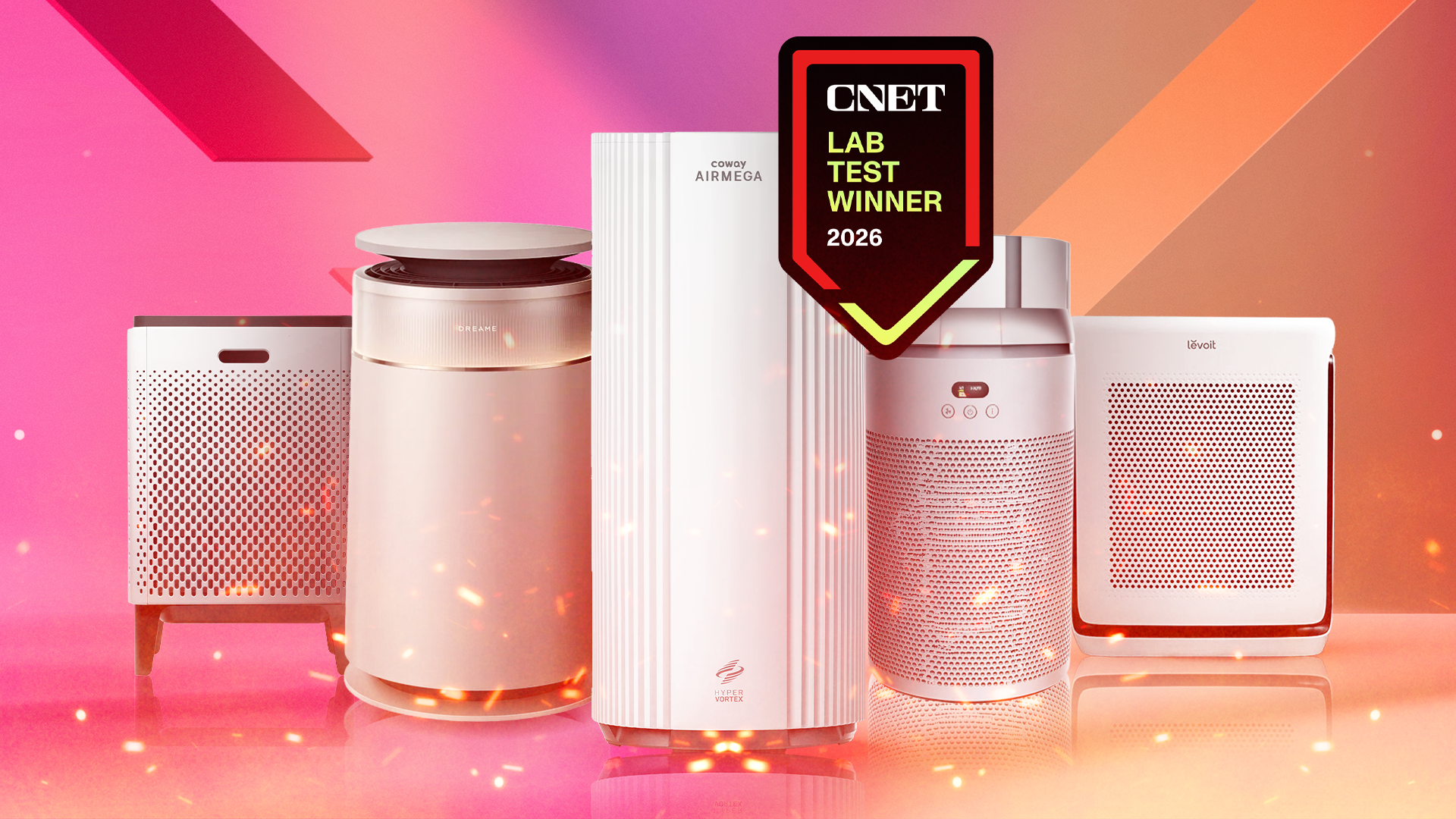 Five air purifiers on an orange and pink gradient background