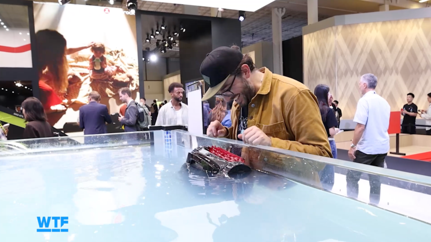 The writer watches a demo of a pool cleaning robot at IFA.