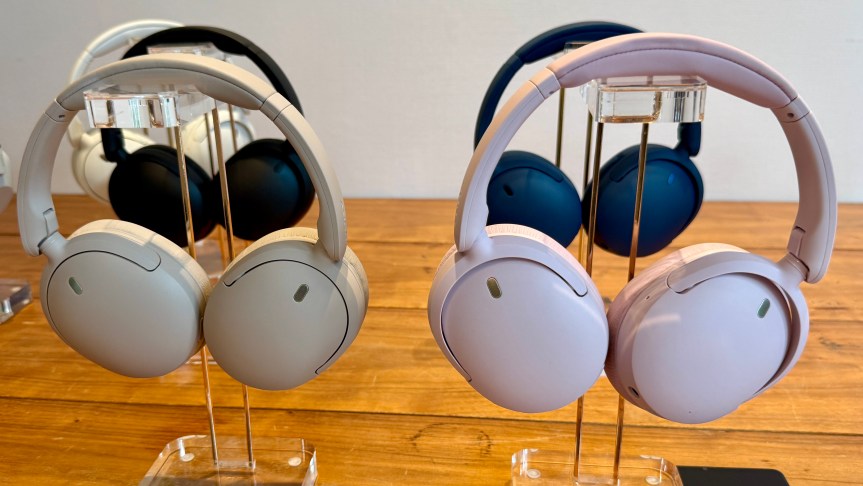 The WH-CH730N shown in its various colors hung up on headphone stands.