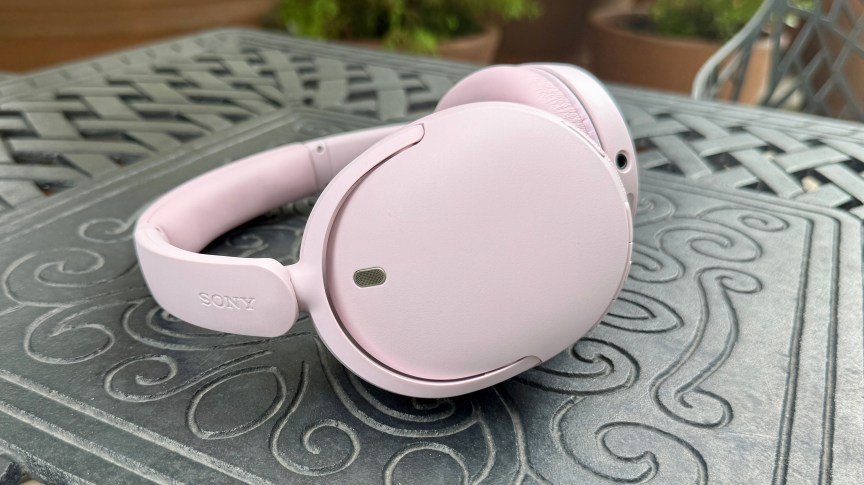 The Sony WH-CH730N shown lying on a table on its side in pink.