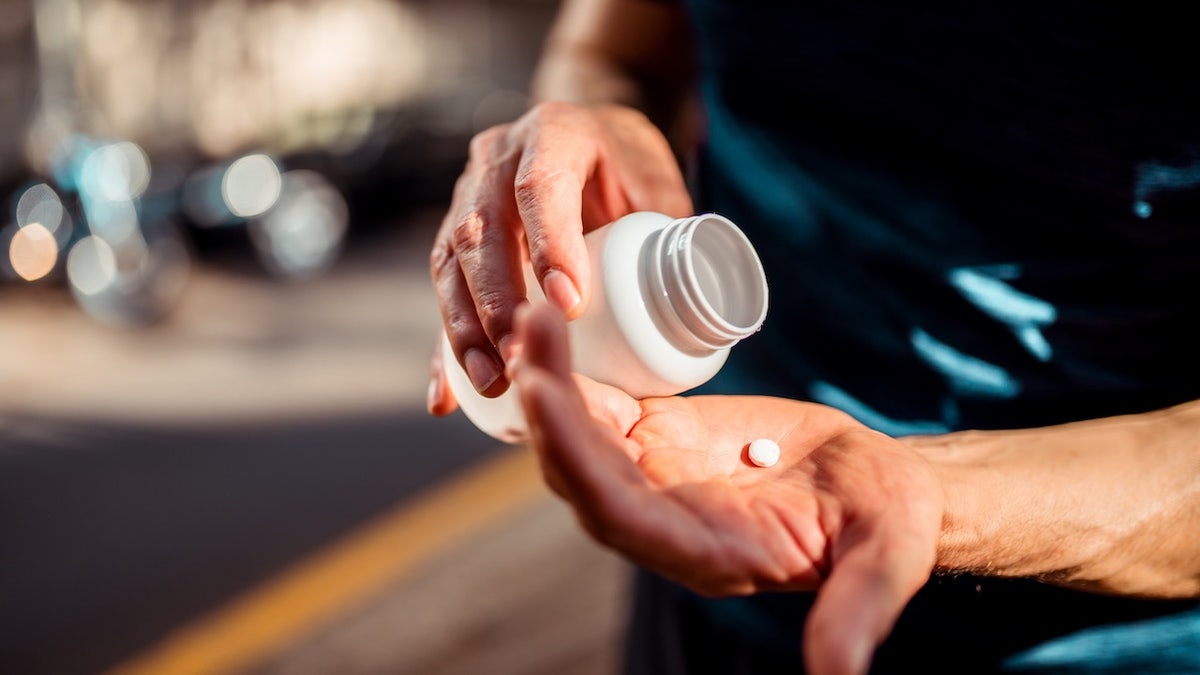 Man taking pill