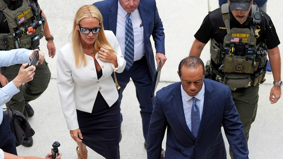 Tiger Woods and Vanessa Trump arrive for a plea conference hearing in Stuart, Florida.